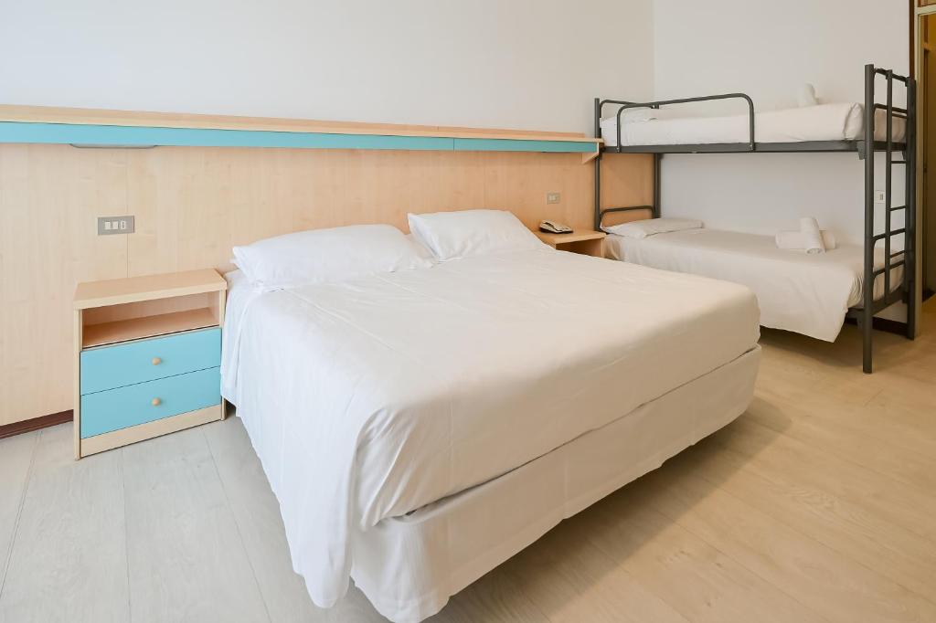 Postel nebo postele na pokoji v ubytování Hotel Las Vegas