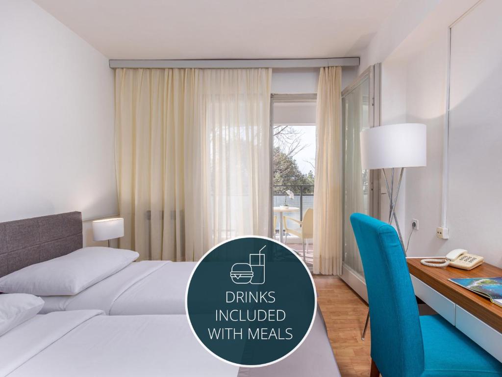 Postel nebo postele na pokoji v ubytování Hotel Zagreb