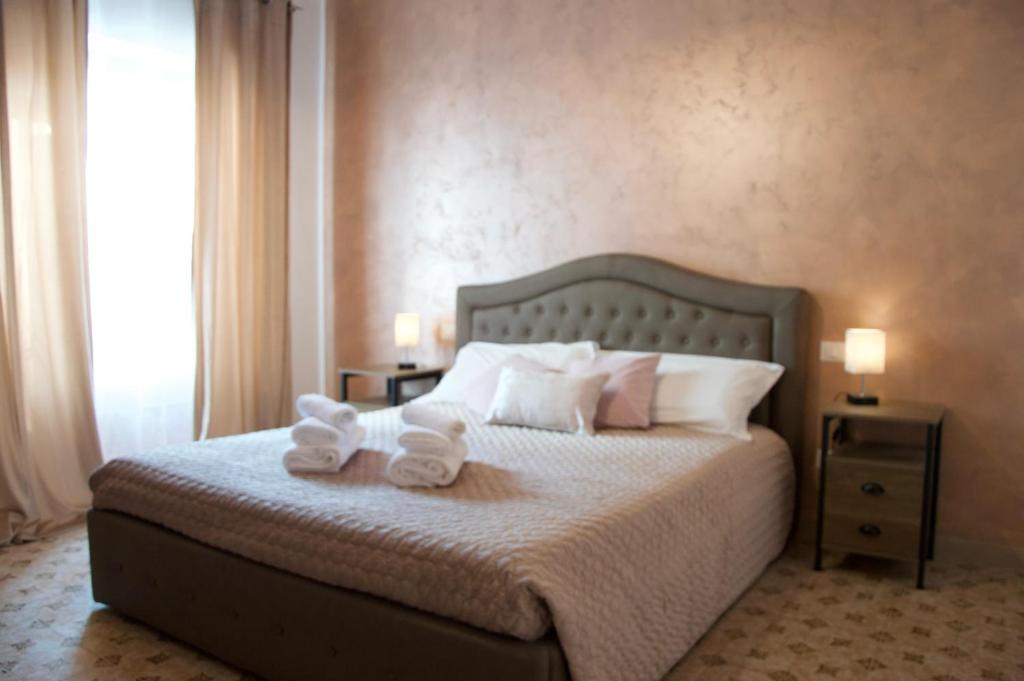 a bedroom with a bed with two teddy bears on it at La Dolce Vita in Cascia