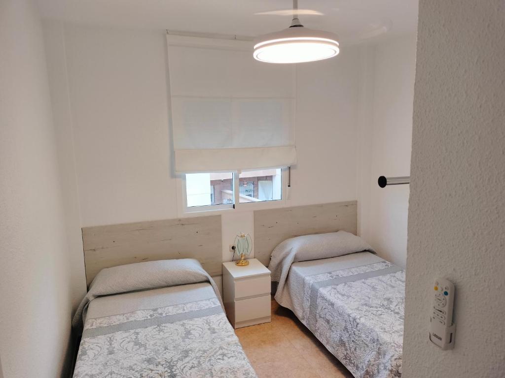 Postel nebo postele na pokoji v ubytování Alojamiento las Dunas