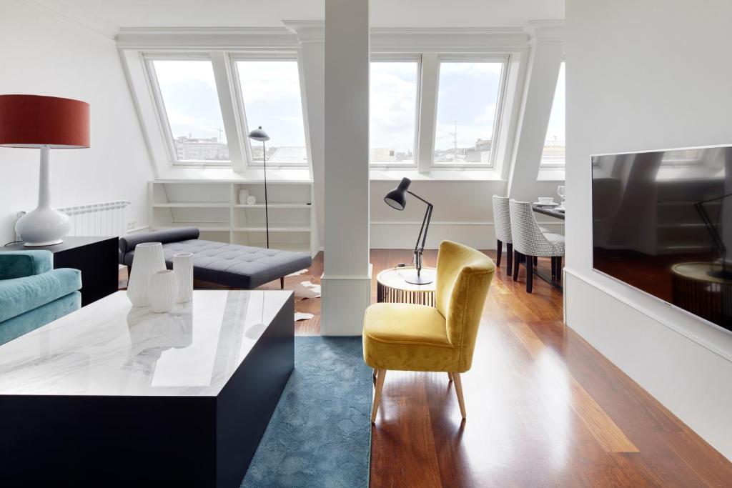 a living room with a couch and a tv at Playa de La Concha 7 by FeelFree Rentals in San Sebastián