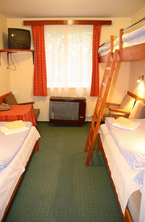 Postel nebo postele na pokoji v ubytování Hotel Touring