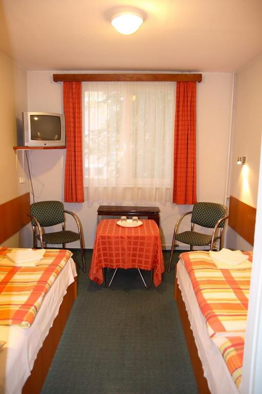 Postel nebo postele na pokoji v ubytování Hotel Touring