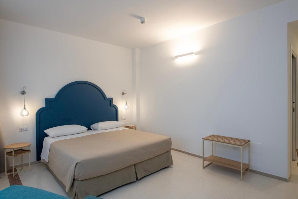 Postel nebo postele na pokoji v ubytování Hotel Albània