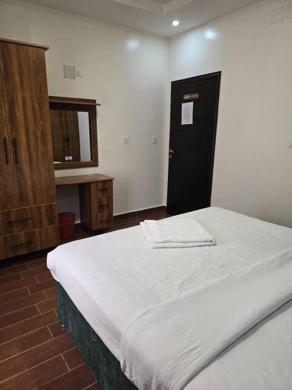 Postel nebo postele na pokoji v ubytování Jikoni Hotel