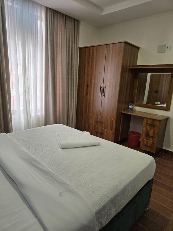Postel nebo postele na pokoji v ubytování Jikoni Hotel