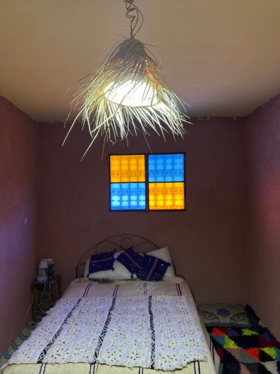 Postel nebo postele na pokoji v ubytování Gite Amani Guest House