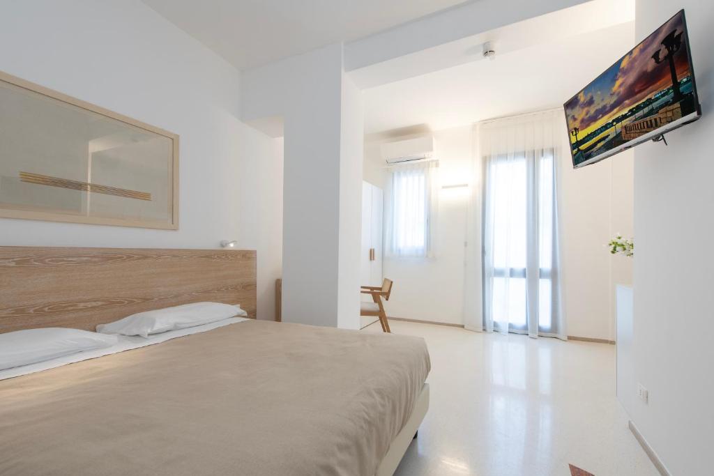 Postel nebo postele na pokoji v ubytování Hotel Albània