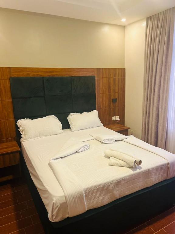 Postel nebo postele na pokoji v ubytování Jikoni Hotel
