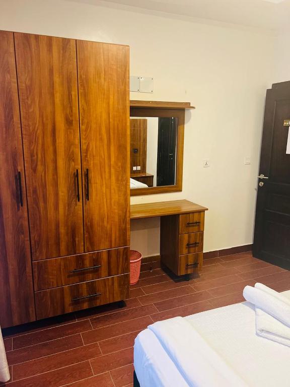 Postel nebo postele na pokoji v ubytování Jikoni Hotel
