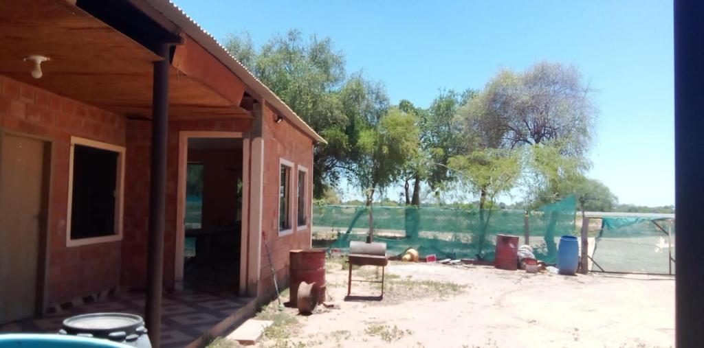 a house being remodeled with a table and chairs at Hospedaje El Quebracho in Caña de Castilla