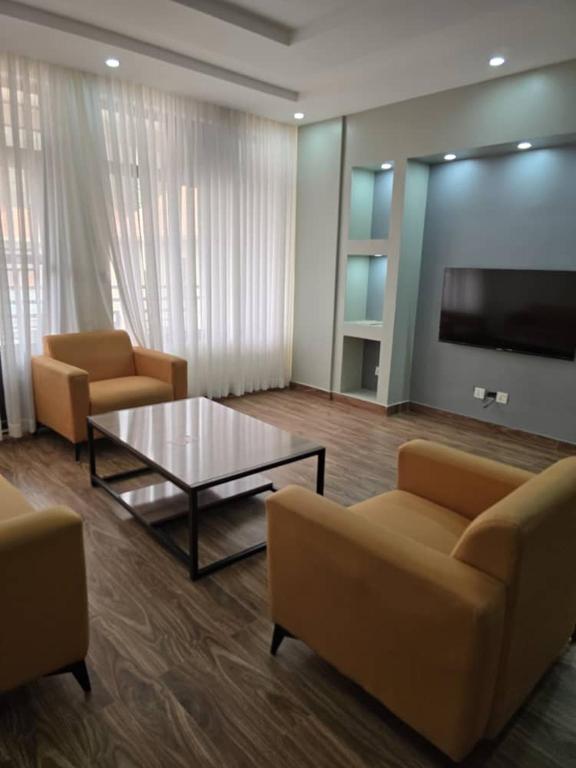 TV a/nebo společenská místnost v ubytování Jikoni Hotel