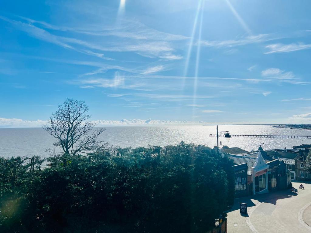 a view of a large body of water with a pier at Stylish 3 Bed Apt Sea Views Near the Beach 2B in Felixstowe
