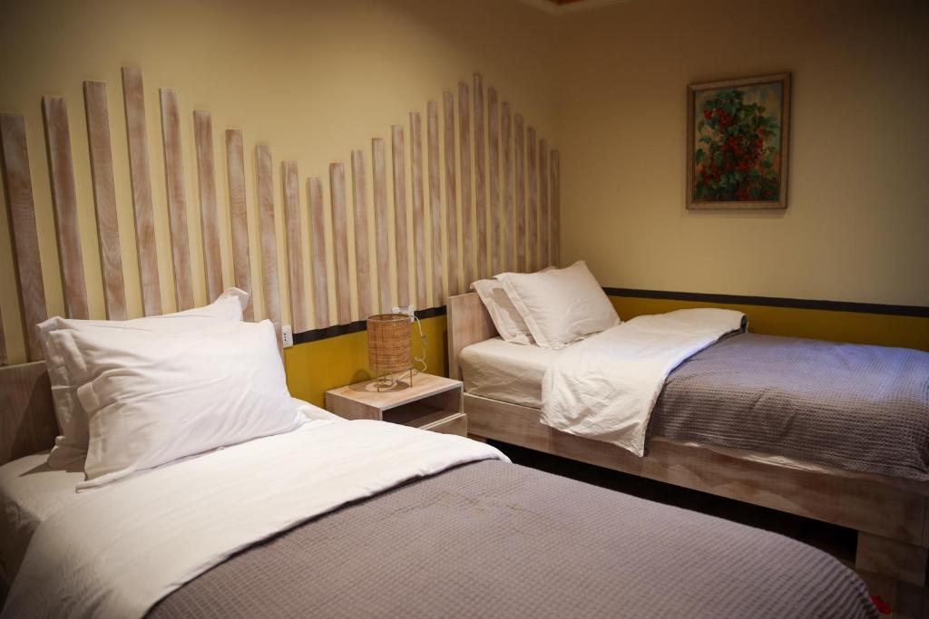 Postel nebo postele na pokoji v ubytování Plis Bujtina - Guesthouse