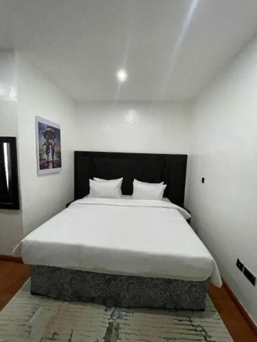 Postel nebo postele na pokoji v ubytování PEPE Suites