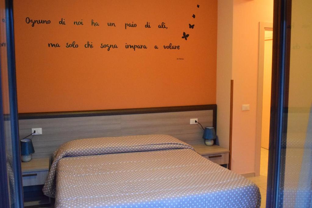 Łóżko lub łóżka w pokoju w obiekcie Villa La Mulinella