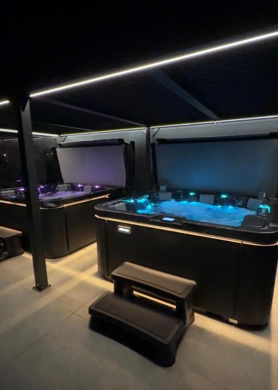 a room with two jacuzzi tubs in a room at Baltic Sea- domki z jacuzzi blisko natury in Władysławowo