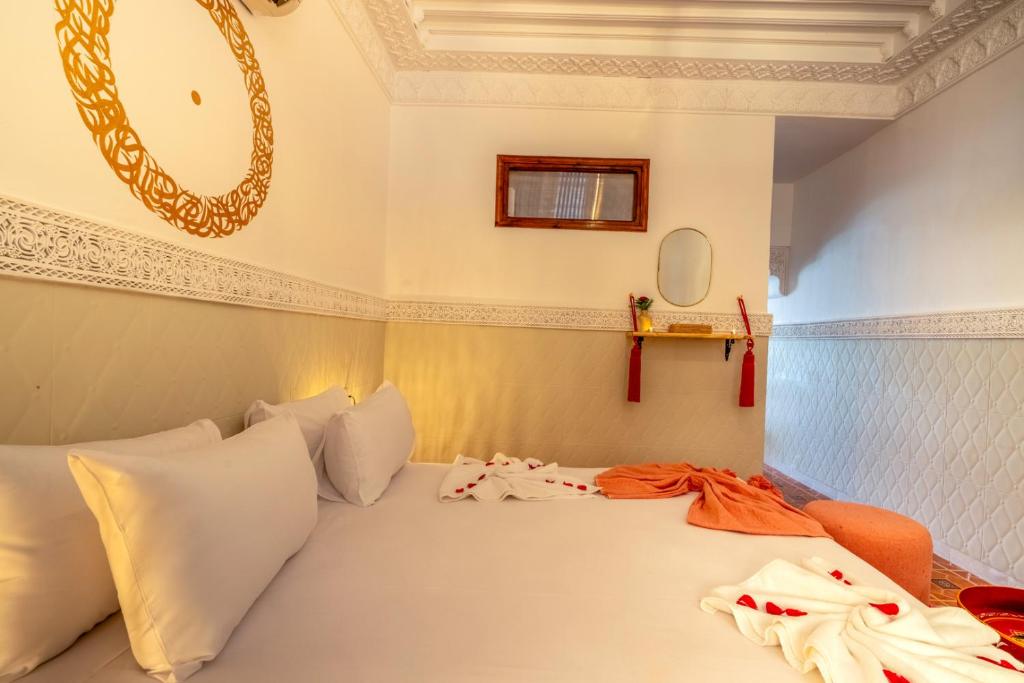 Postel nebo postele na pokoji v ubytování Palais Moulay Said & SPA
