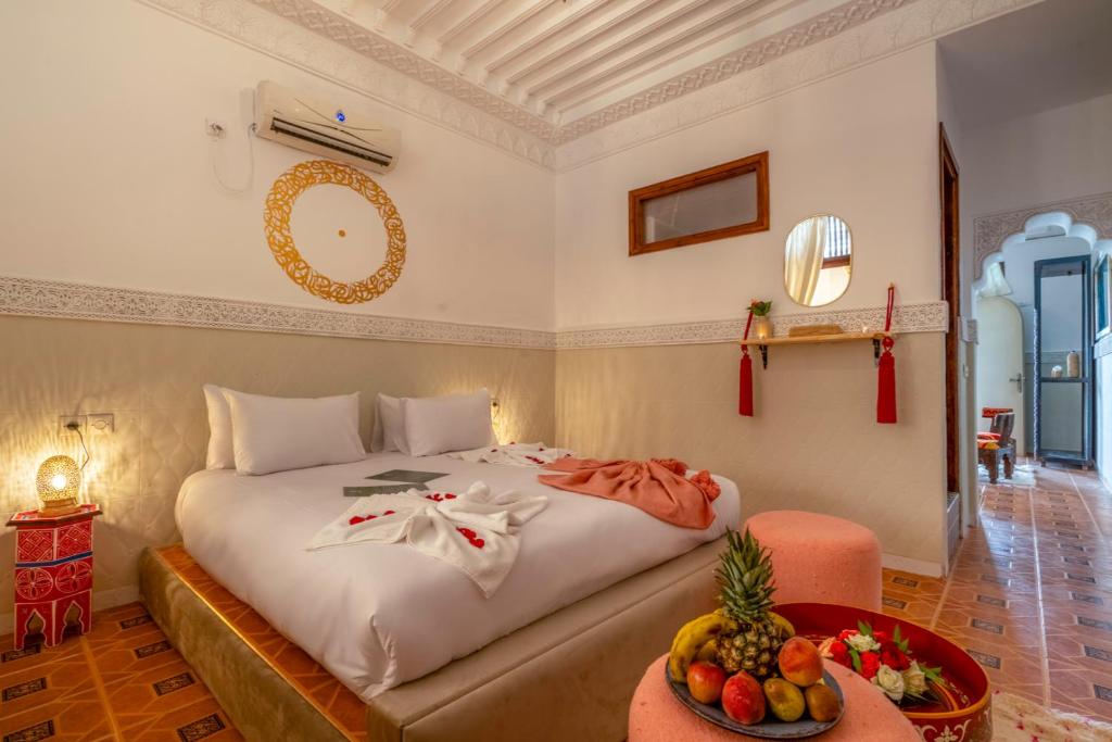 Postel nebo postele na pokoji v ubytování Palais Moulay Said & SPA