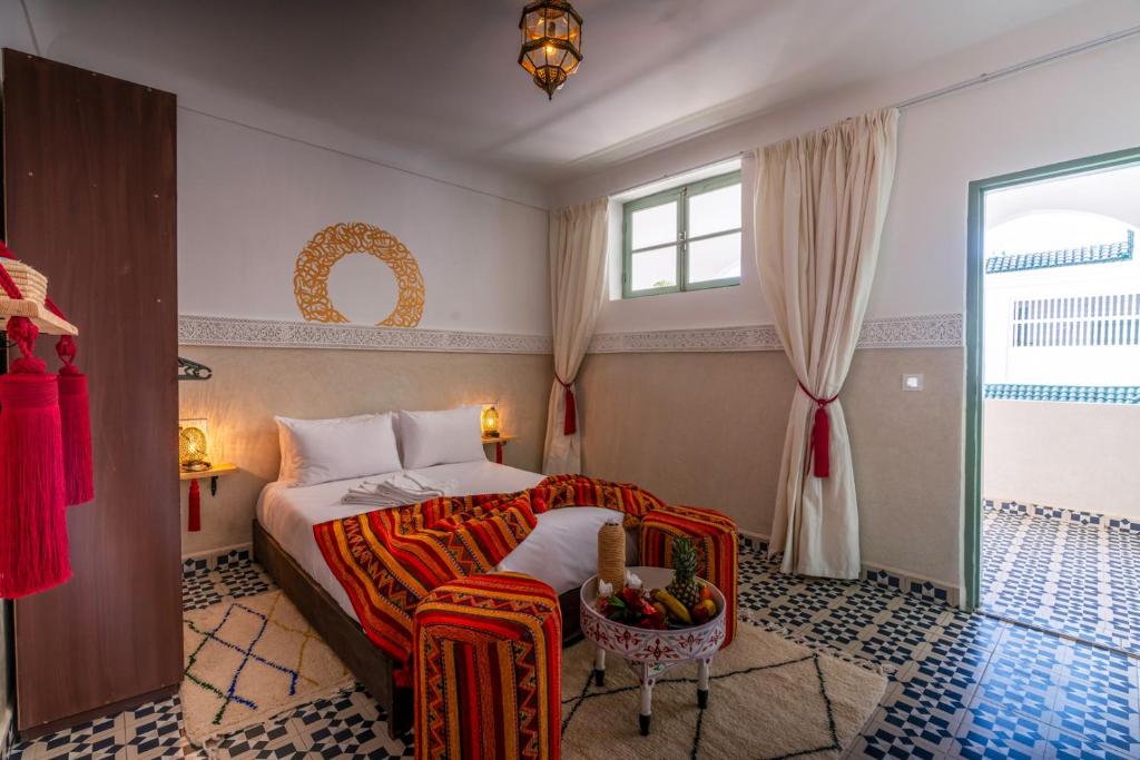 Postel nebo postele na pokoji v ubytování Palais Moulay Said & SPA