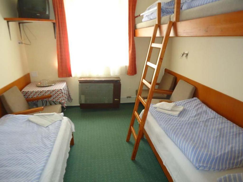 Postel nebo postele na pokoji v ubytování Hotel Touring