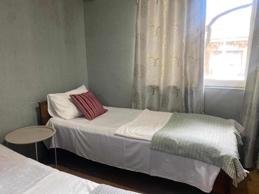 Postel nebo postele na pokoji v ubytování Hotel Prime