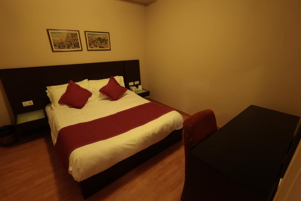 Postel nebo postele na pokoji v ubytování Monteverde Hotel
