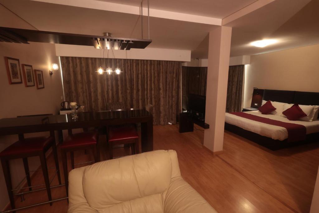 Postel nebo postele na pokoji v ubytování Monteverde Hotel