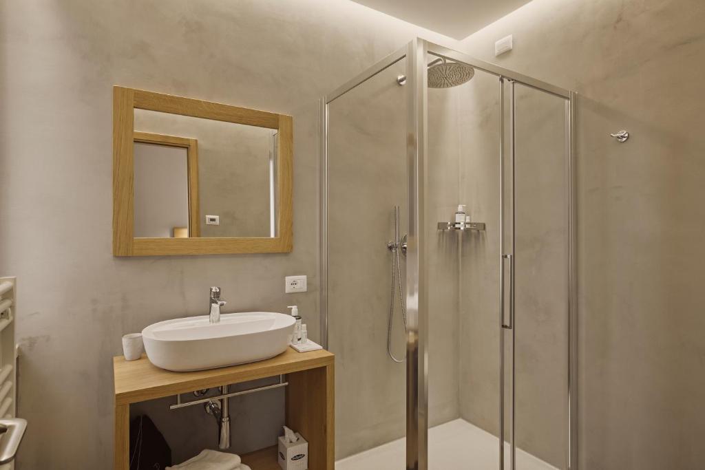 Een badkamer bij Hotel Le Mura