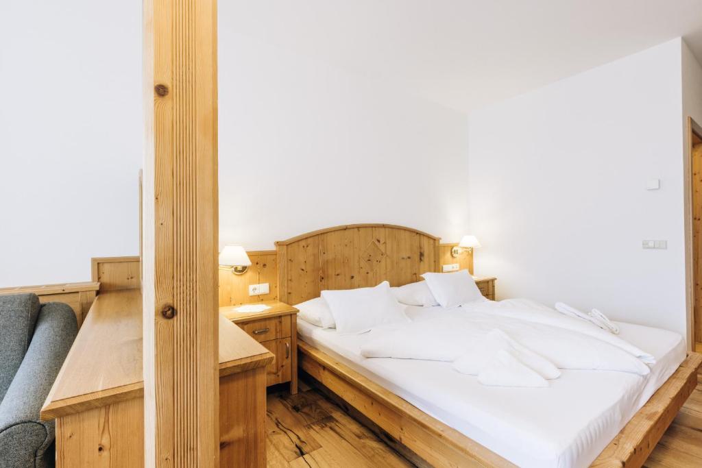 Posteľ alebo postele v izbe v ubytovaní Hotel Tenz