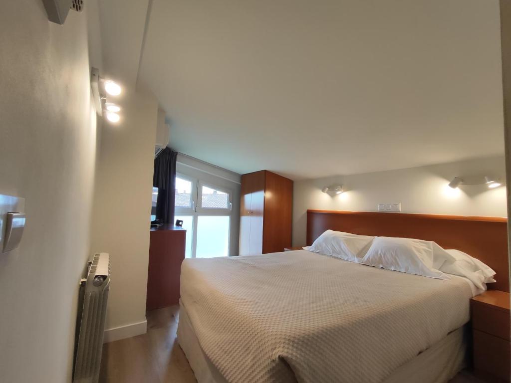 Postel nebo postele na pokoji v ubytování Hotel Rural Tierras del Cid
