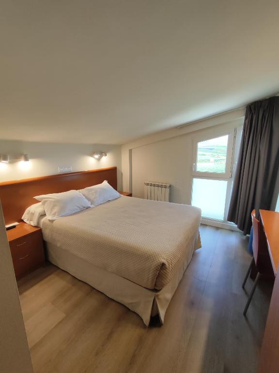 Postel nebo postele na pokoji v ubytování Hotel Rural Tierras del Cid