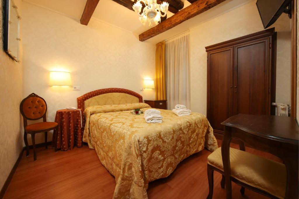 Postelja oz. postelje v sobi nastanitve Hotel Da Bruno