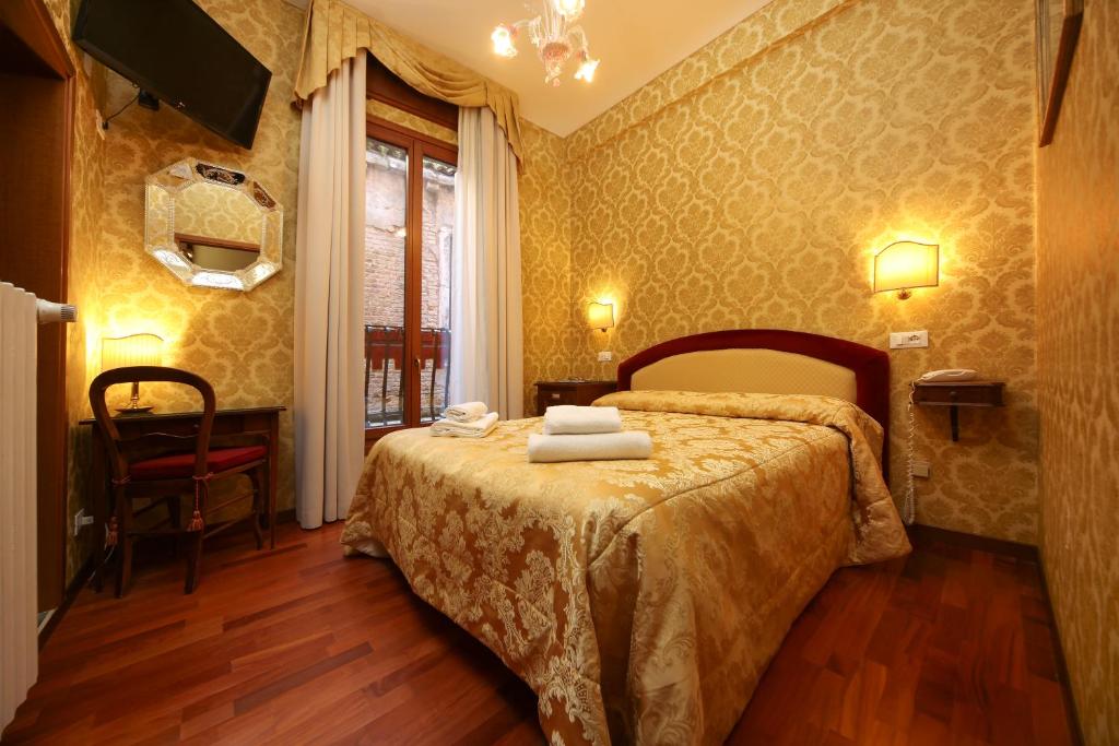 Postelja oz. postelje v sobi nastanitve Hotel Da Bruno