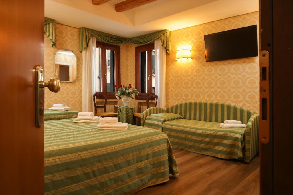 Postelja oz. postelje v sobi nastanitve Hotel Da Bruno