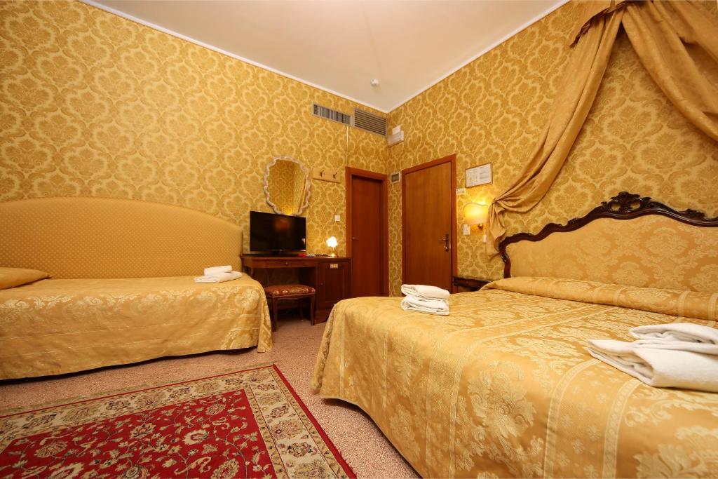 Postelja oz. postelje v sobi nastanitve Hotel Da Bruno