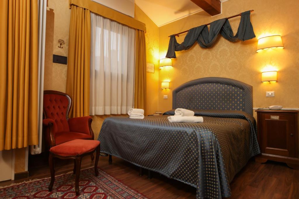 Postelja oz. postelje v sobi nastanitve Hotel Da Bruno