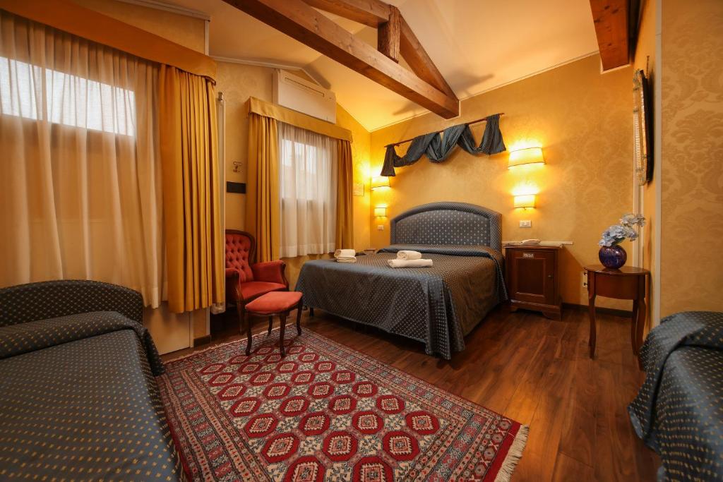 Postelja oz. postelje v sobi nastanitve Hotel Da Bruno