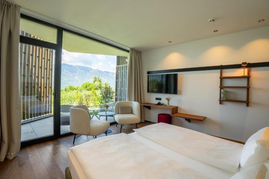 Posteľ alebo postele v izbe v ubytovaní Hotel Tenz