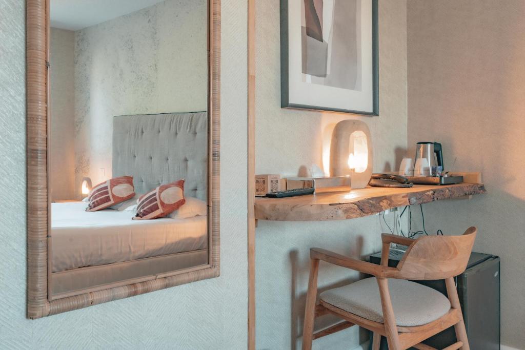 Postel nebo postele na pokoji v ubytování Hôtel Édenia - Spa Estime&Sens