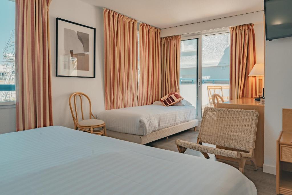Postel nebo postele na pokoji v ubytování Hôtel Édenia - Spa Estime&Sens