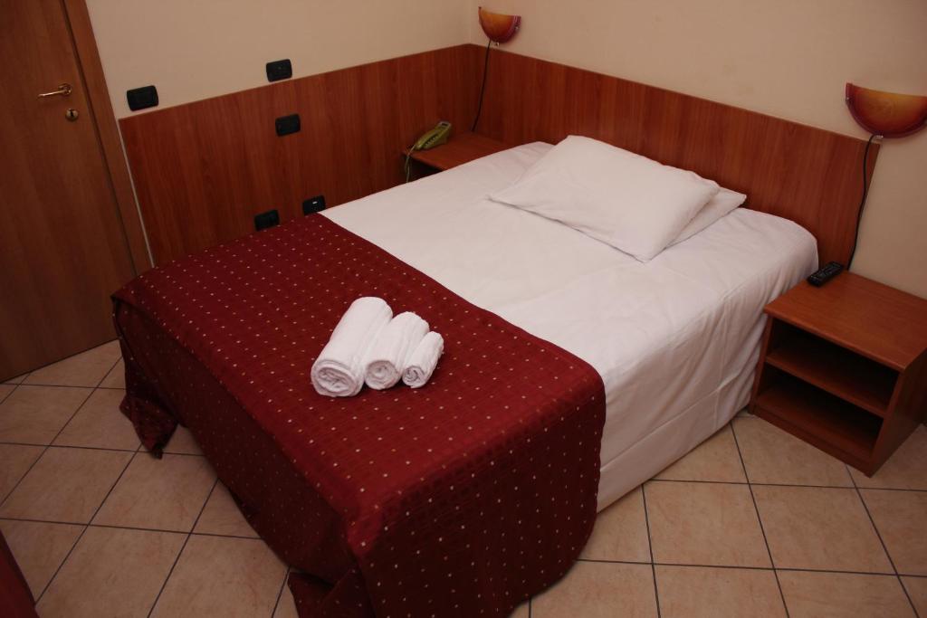 Postel nebo postele na pokoji v ubytování Albergo Hotel Giardino