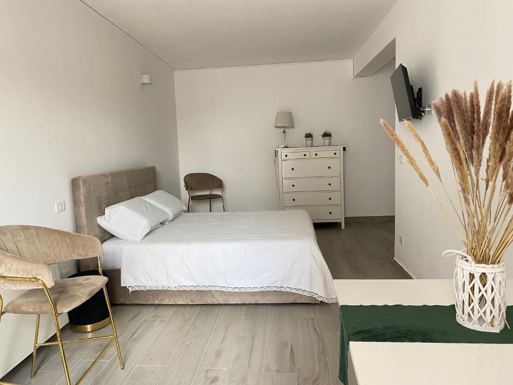 Postel nebo postele na pokoji v ubytování Monolocale moderno