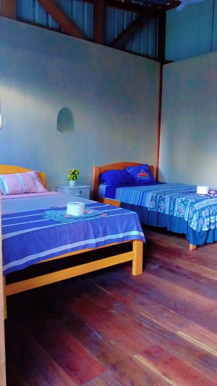 Postel nebo postele na pokoji v ubytování Refugio Chabelita Hostel