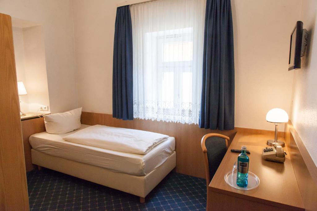 Postel nebo postele na pokoji v ubytování Akzent Hotel Schranne