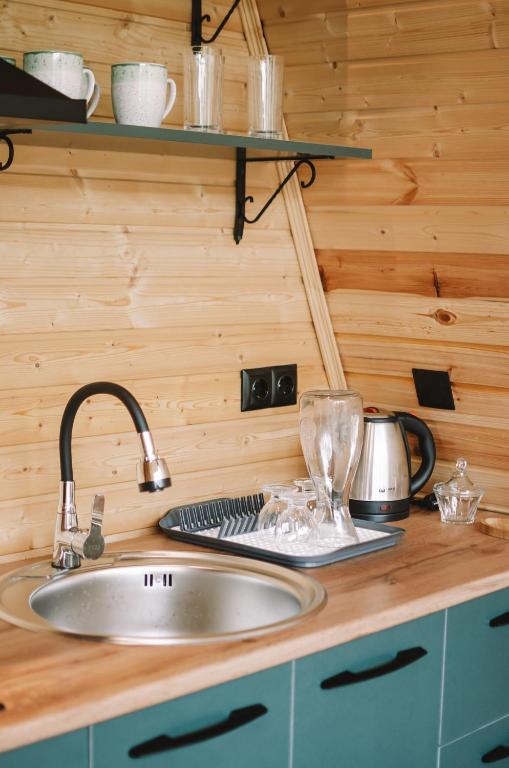 Kuchyň nebo kuchyňský kout v ubytování Kakhshiani Mestia Cottages