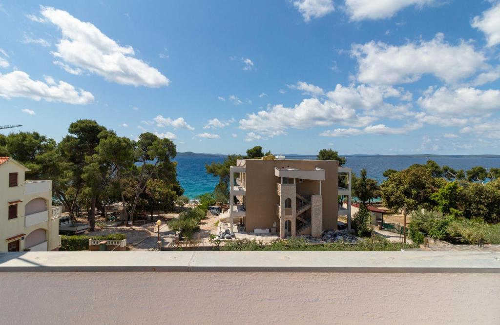 a view of the ocean from the roof of a building at NEW! Apartment in Petrčane 30 meters from the sea - TA Leut Agency in Petrcane