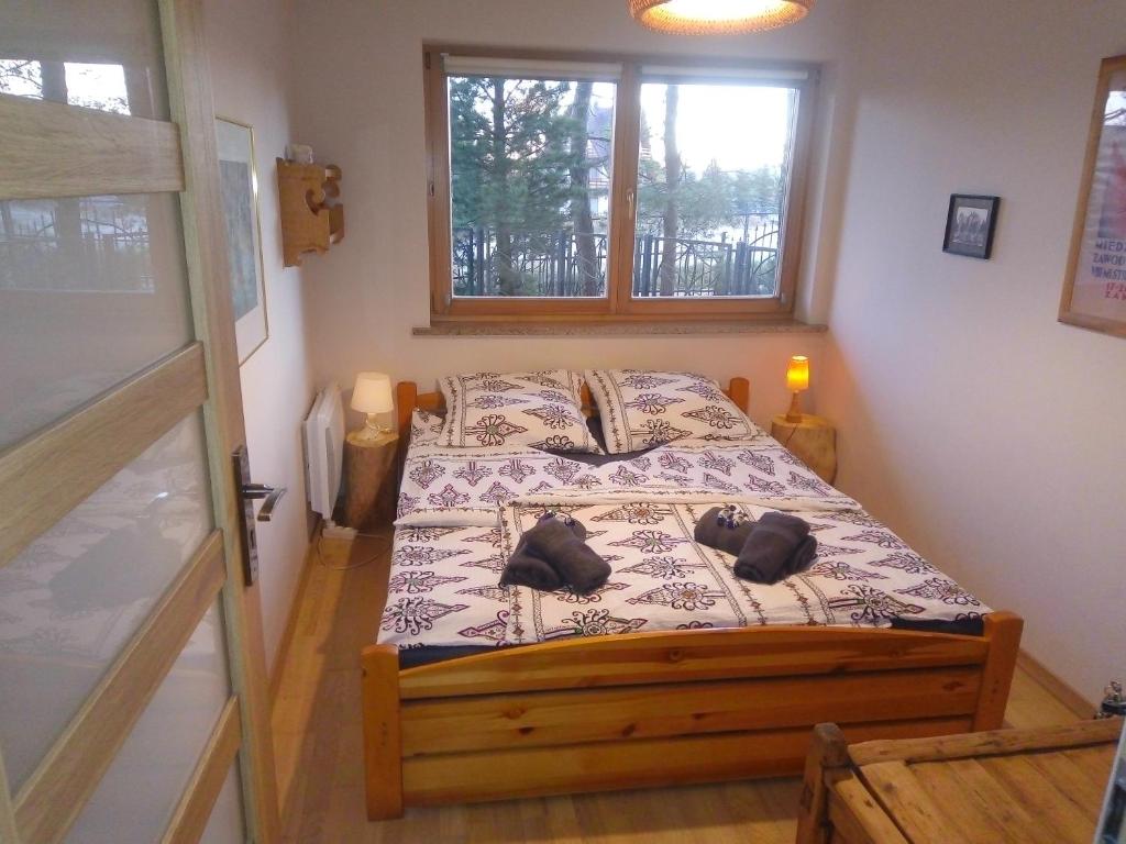 Posteľ alebo postele v izbe v ubytovaní Apartament Cyrhla Zakopane