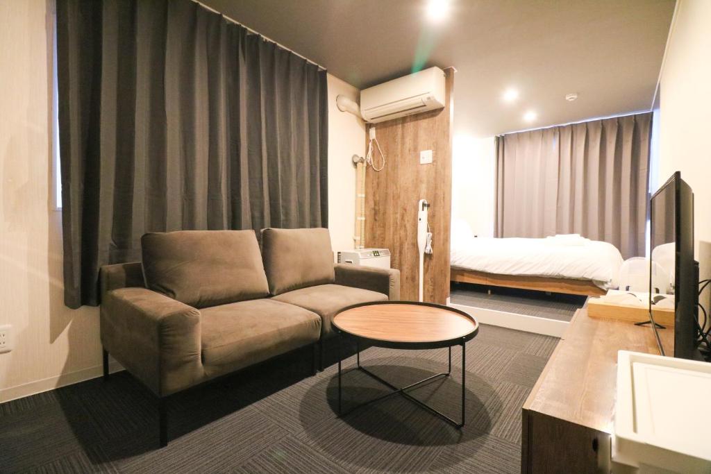 En eller flere senge i et værelse på Maison Odori Higashi Building