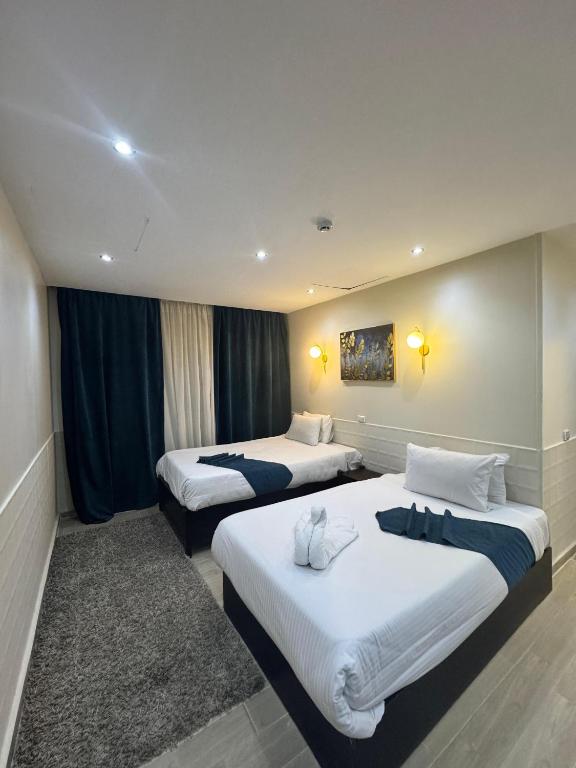 Postel nebo postele na pokoji v ubytování New Star Zamalek Hotel